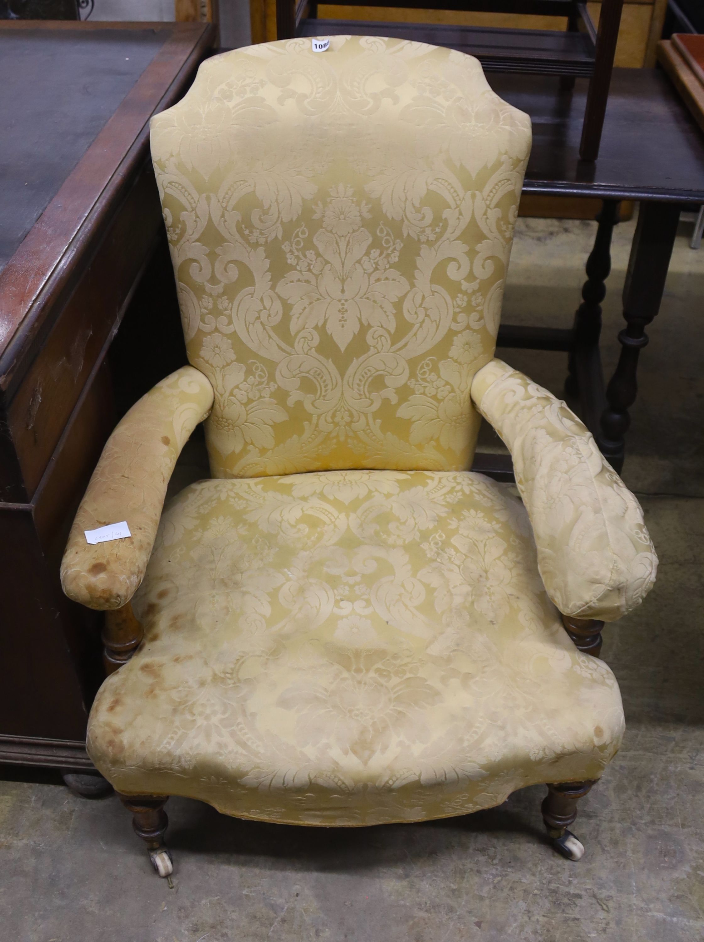 A Victorian upholstered open armchair, width 70cm, depth 76cm, height 94cm